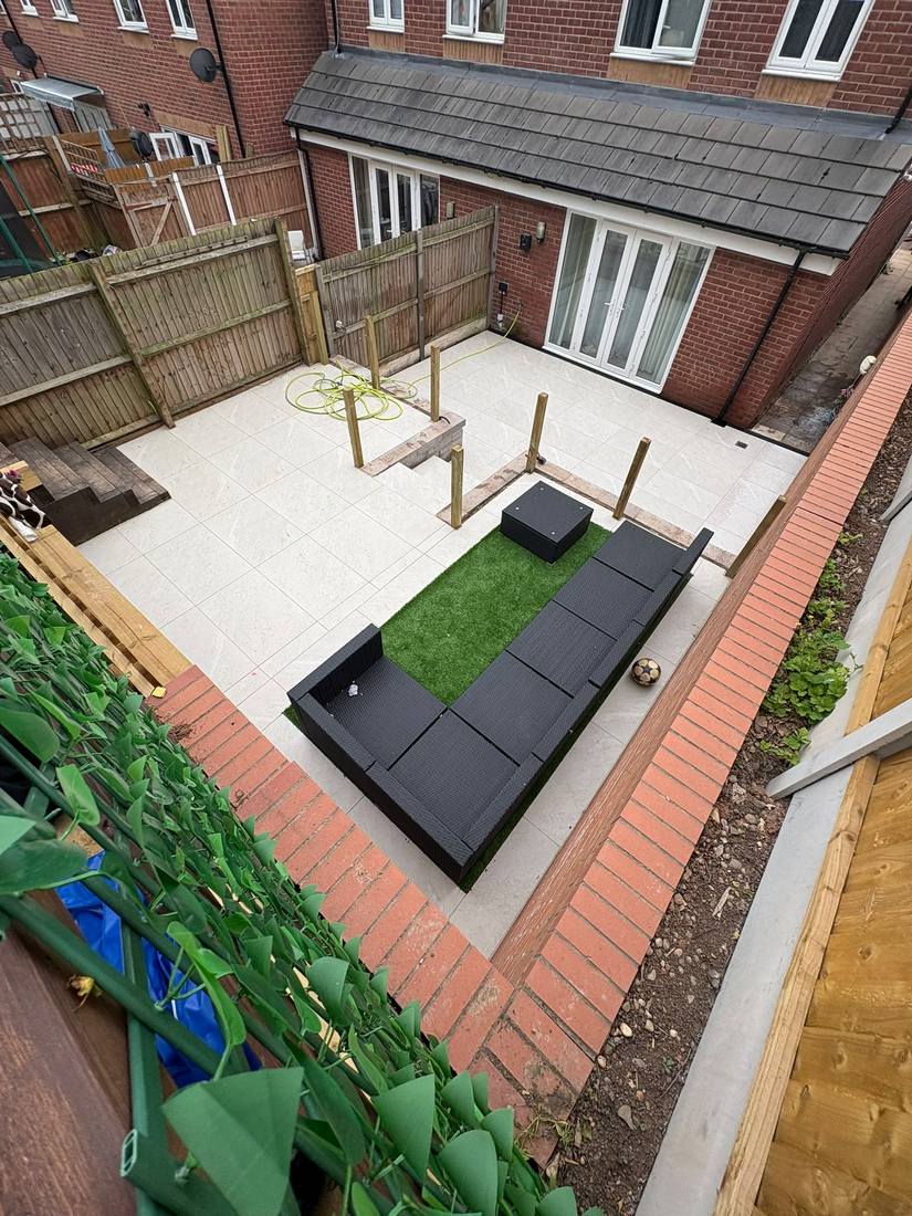 A white porcelain patio with black garden seating