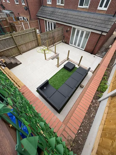 A white porcelain patio with black garden seating